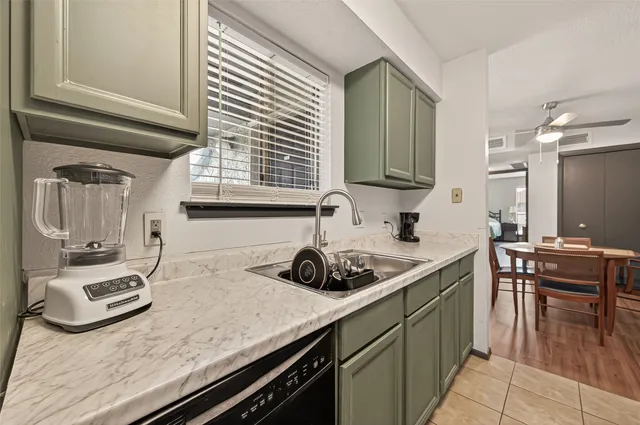 a kitchen with a sink and cabinets