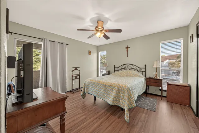 a bedroom with a bed and a desk