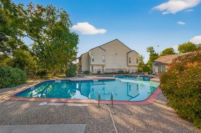 a view of a house with swimming pool