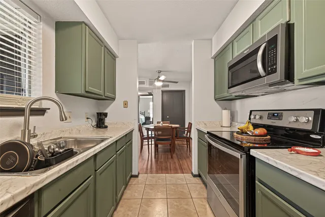 a kitchen with a stove and a sink