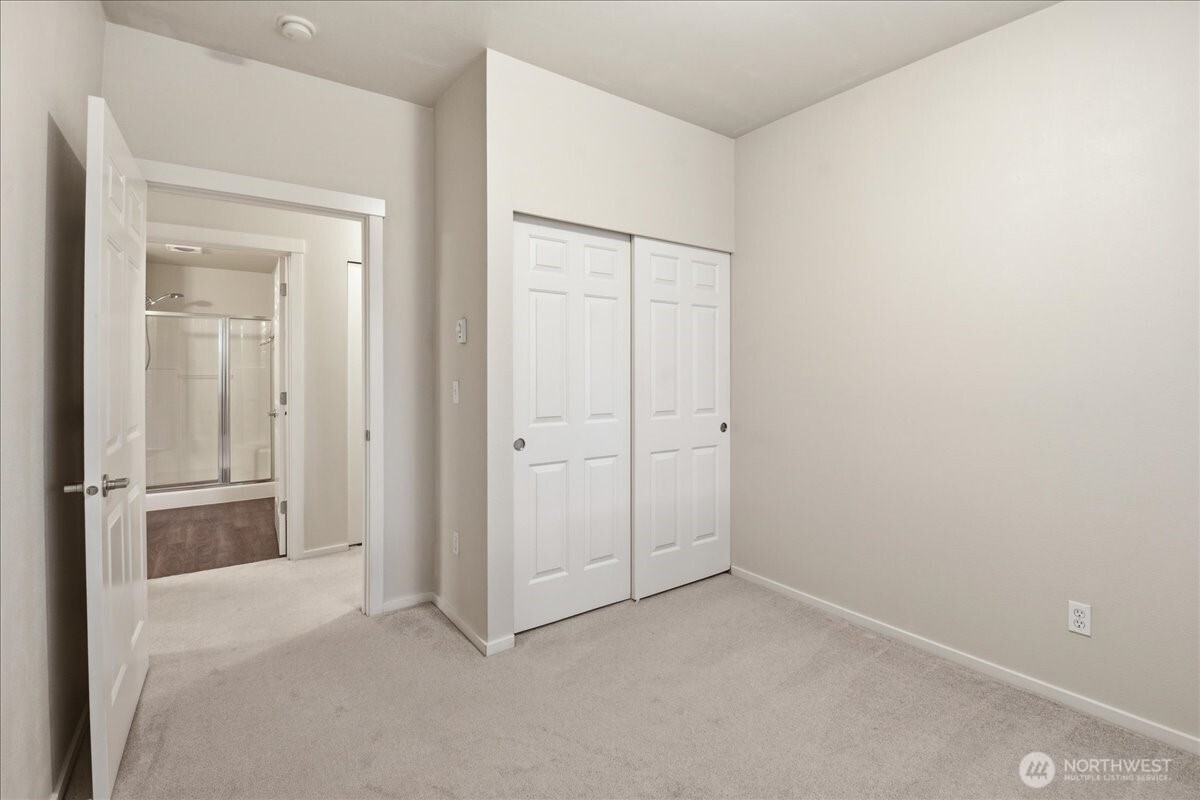 107 164th Street Southeast, Unit 2103 Bothell, WA 98012 - Photo 12 of 24 an empty room with closet area