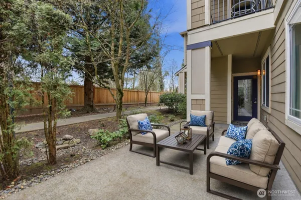 a patio with patio a couch and chairs
