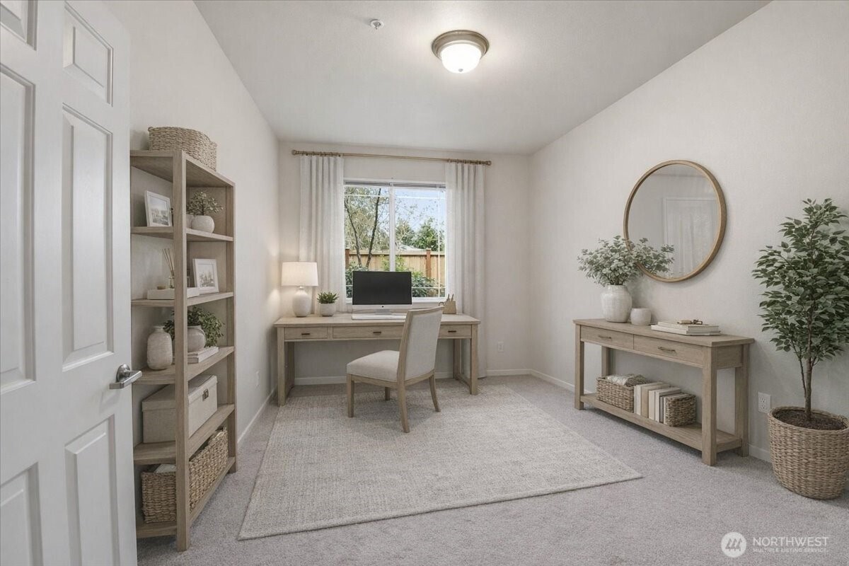 107 164th Street Southeast, Unit 2103 Bothell, WA 98012 - Photo 3 of 24 a living room with furniture a fireplace and a floor to ceiling window