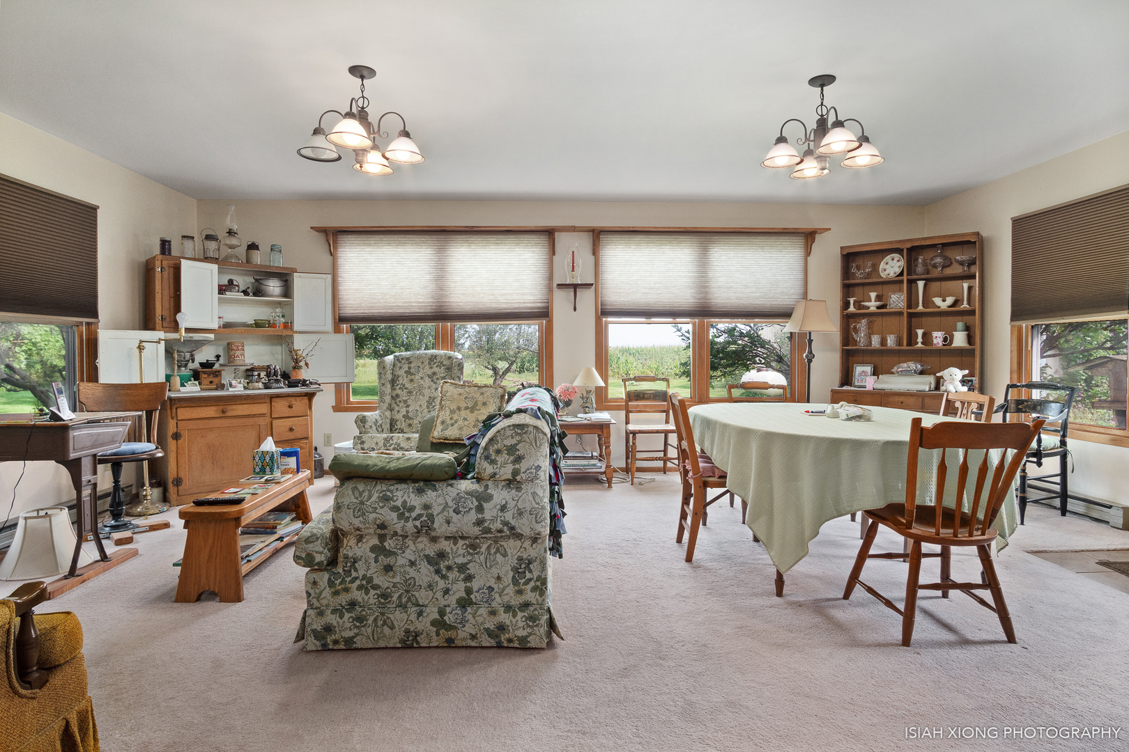 45W702 Wheeler Road Sugar Grove, IL 60554 - Photo 15 of 49 a living room with furniture a chandelier and a large window