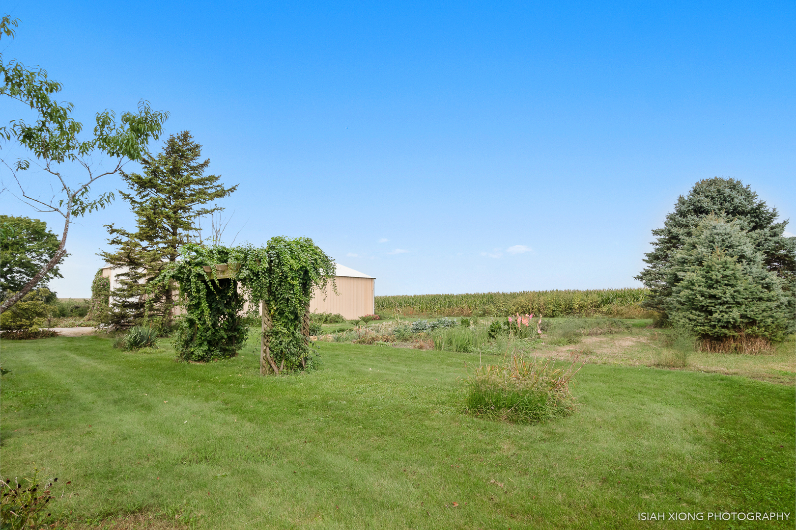 45W702 Wheeler Road Sugar Grove, IL 60554 - Photo 42 of 49 a view of a garden with a building in the background