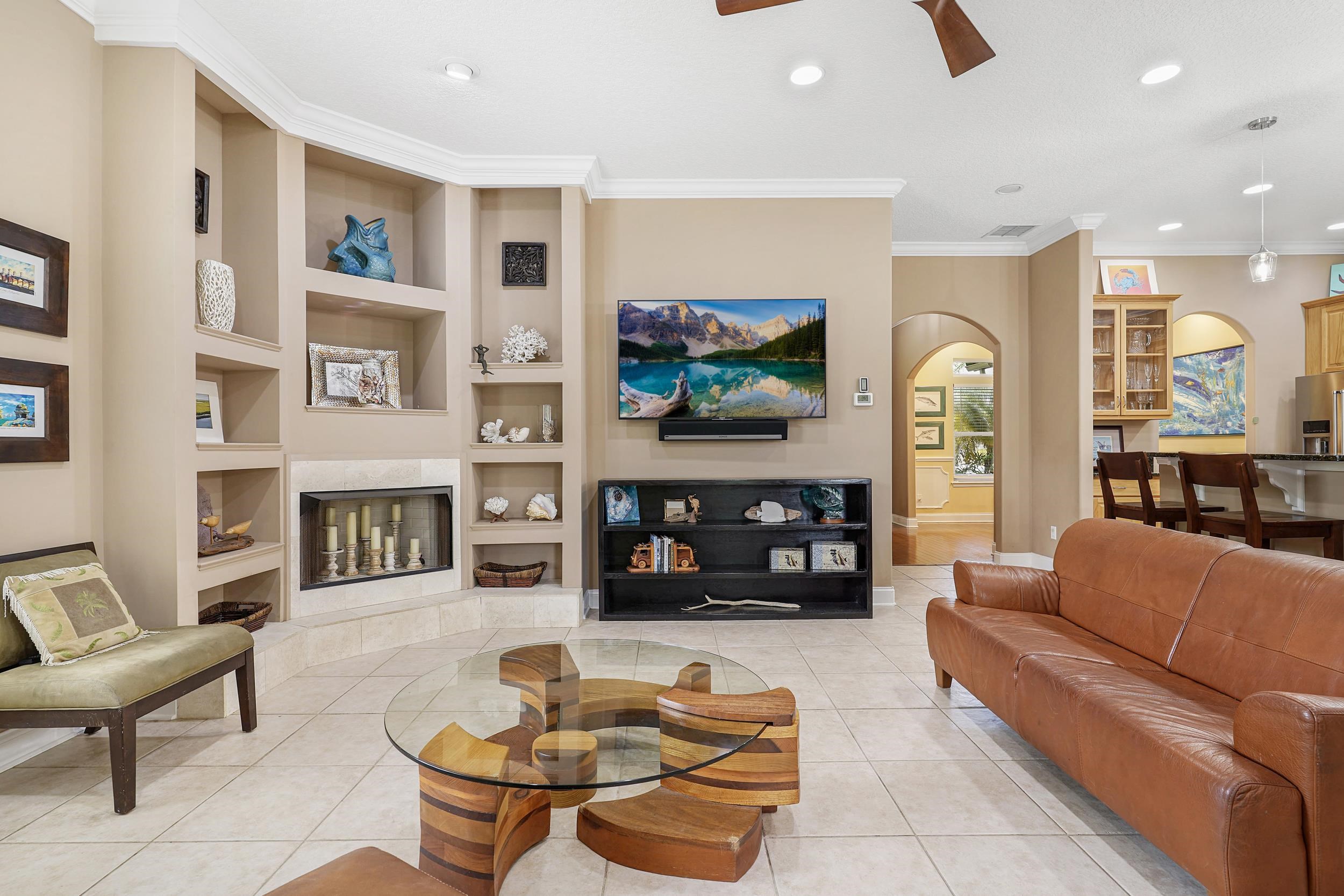 509 Twentieth Street St. Augustine, FL 32084 - Photo 11 of 40 a living room with furniture a fireplace and a flat screen tv