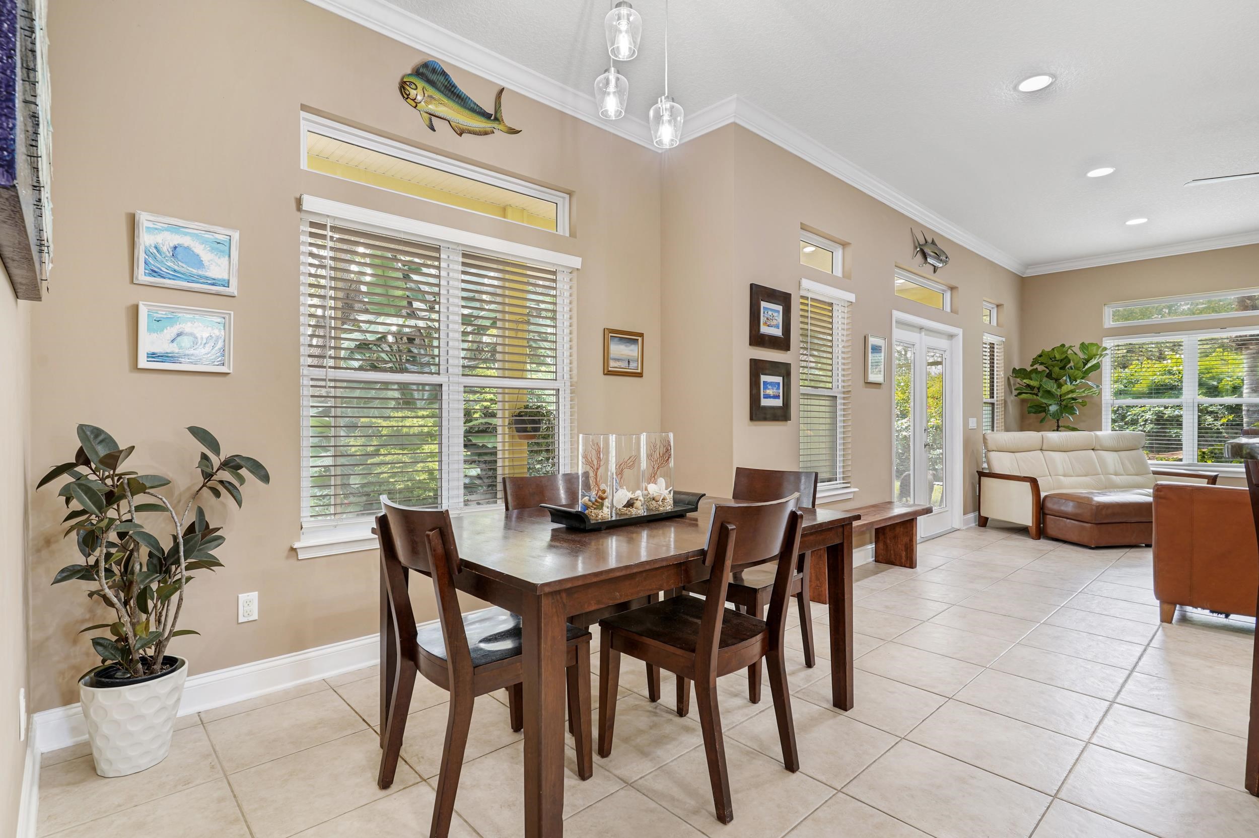 509 Twentieth Street St. Augustine, FL 32084 - Photo 13 of 40 a dining room with furniture and large windows