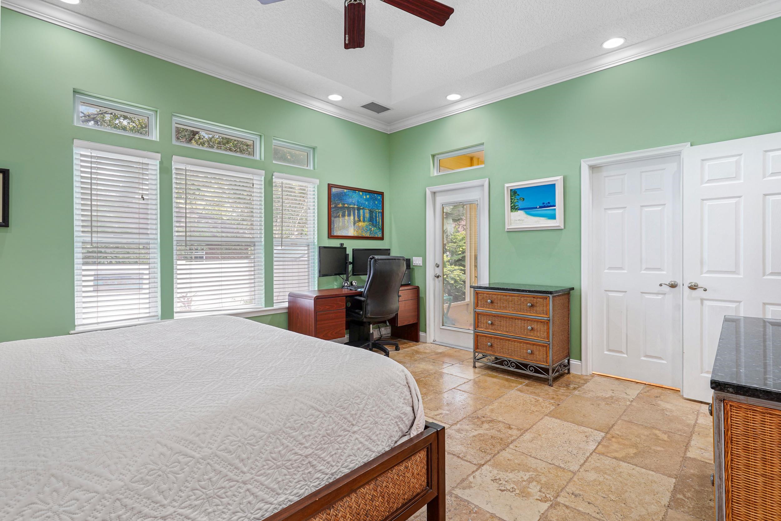 509 Twentieth Street St. Augustine, FL 32084 - Photo 20 of 40 a bed room with a bed and furniture