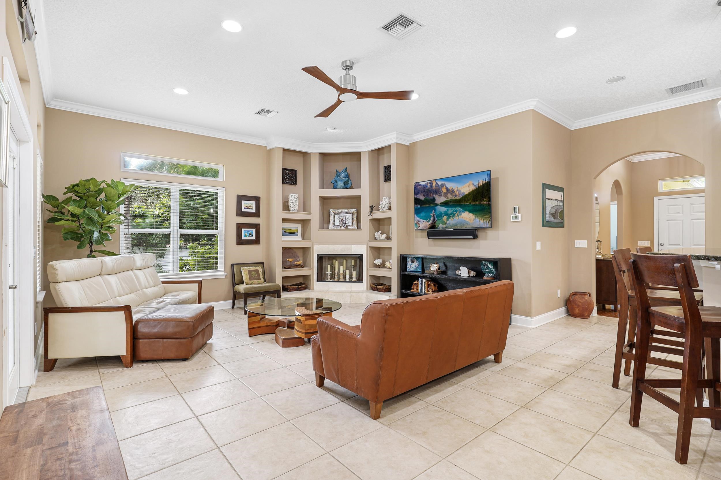 509 Twentieth Street St. Augustine, FL 32084 - Photo 2 of 40 a living room with furniture and a flat screen tv