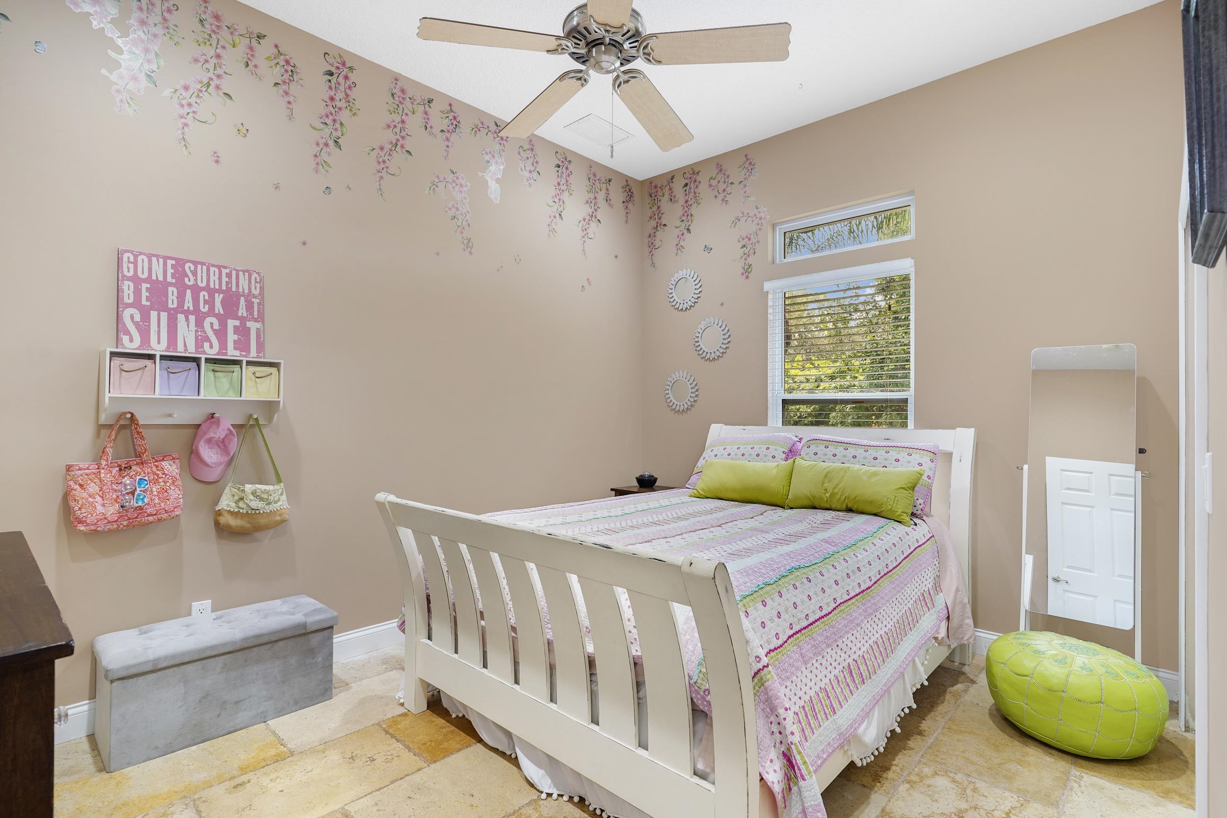 509 Twentieth Street St. Augustine, FL 32084 - Photo 26 of 40 a bedroom with a bed and a chandelier