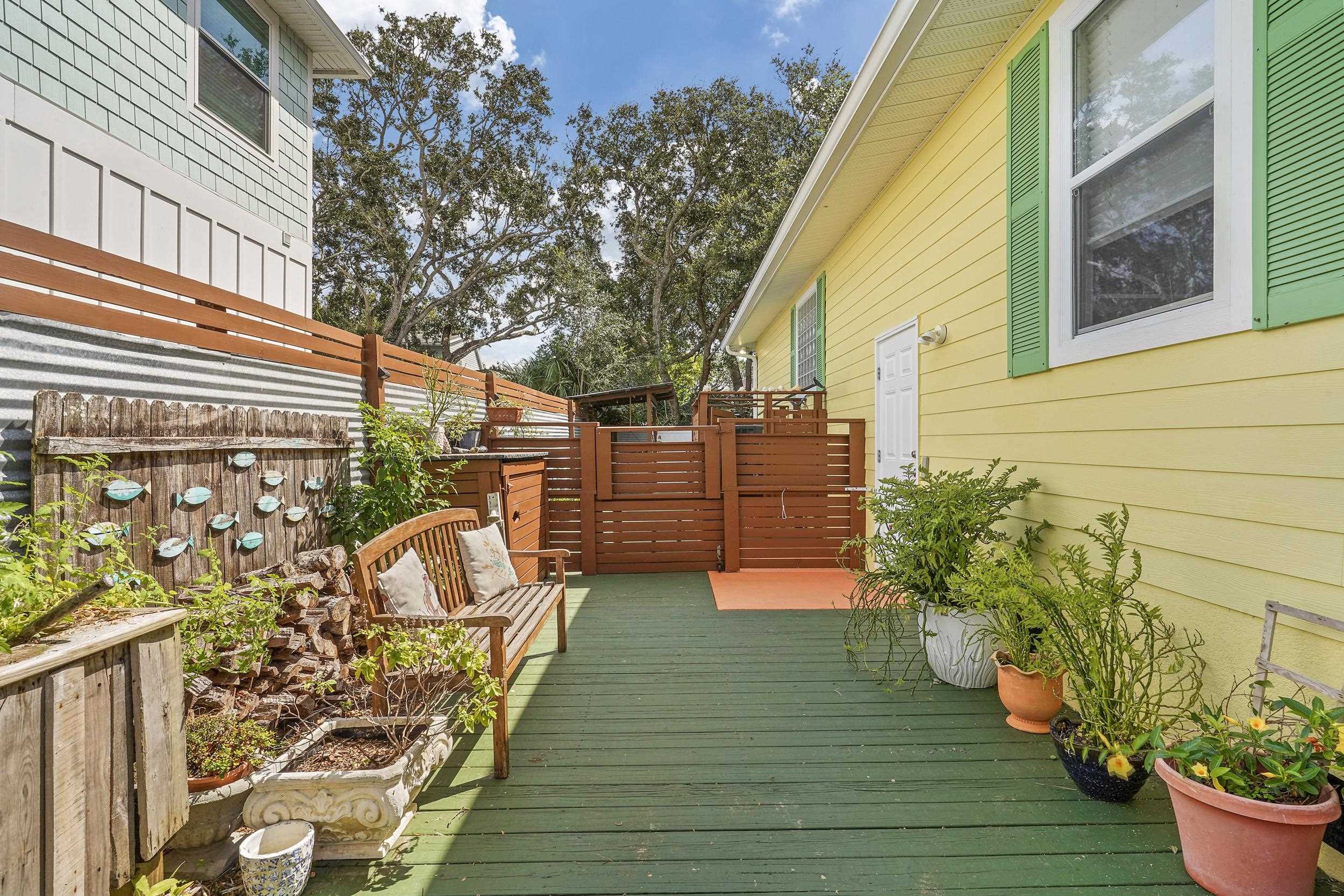 509 Twentieth Street St. Augustine, FL 32084 - Photo 29 of 40 a view of a backyard with sitting area