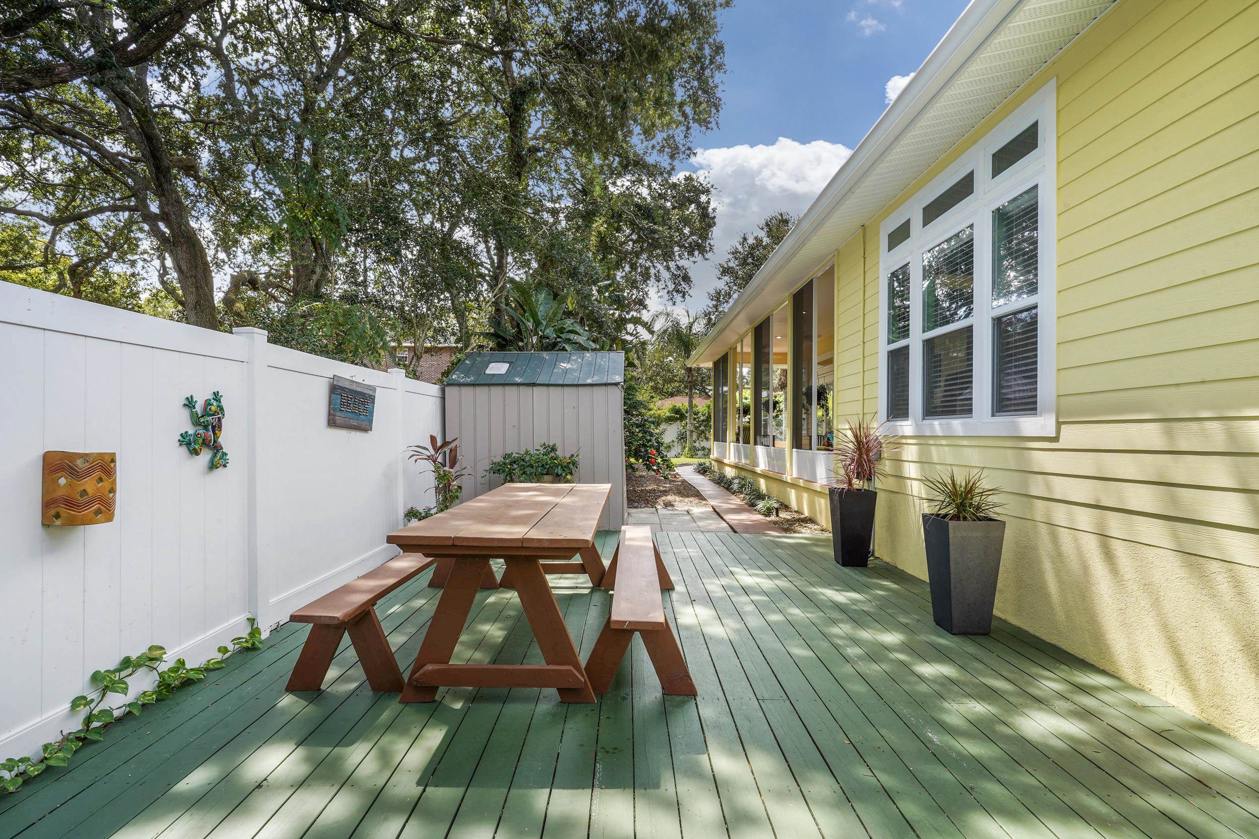 509 Twentieth Street St. Augustine, FL 32084 - Photo 32 of 40 a view of a house with backyard and sitting area