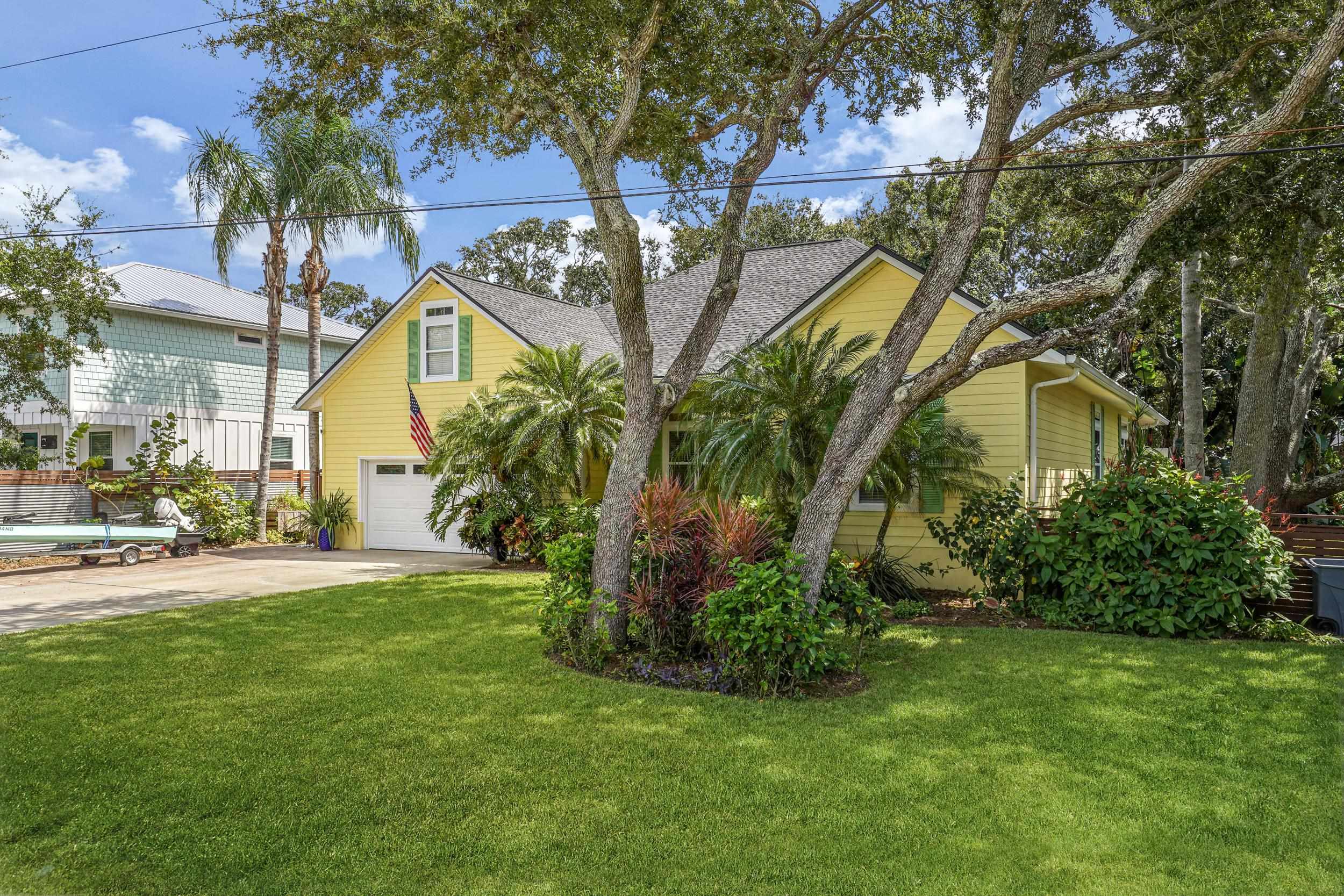 509 Twentieth Street St. Augustine, FL 32084 - Photo 40 of 40 a view of a white house in a big yard with palm trees