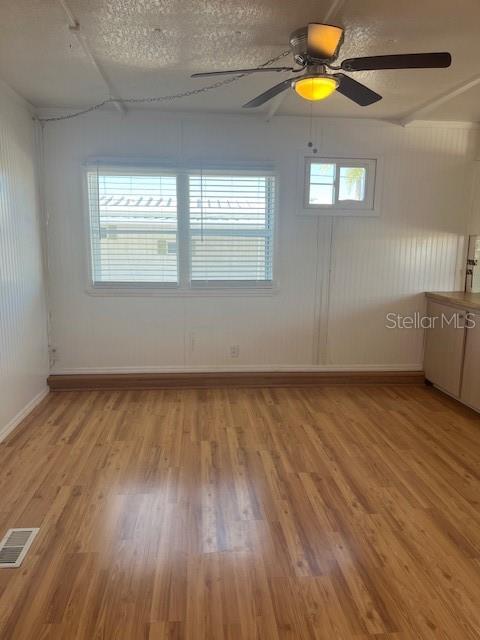 10315 Cortez Road West, Unit 15G Bradenton, FL 34210 - Photo 11 of 77 wooden floor in an empty room with a window
