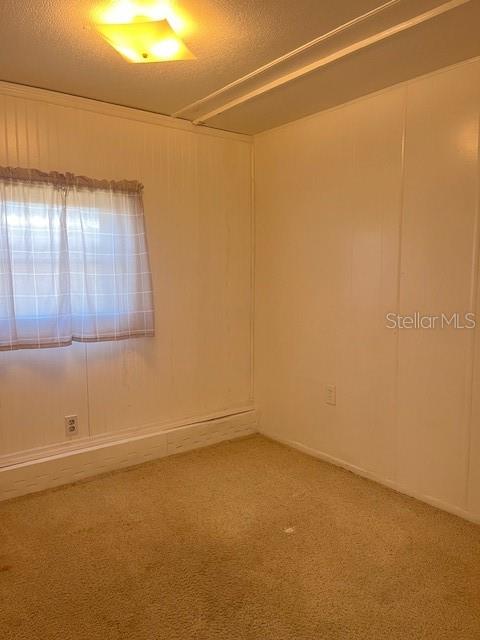 10315 Cortez Road West, Unit 15G Bradenton, FL 34210 - Photo 12 of 77 a view of a room with wooden floor and windows
