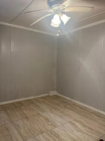 a view of a backyard with sitting area