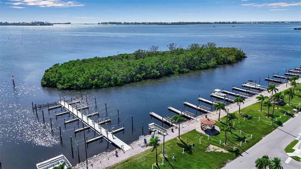 10315 Cortez Road West, Unit 15G Bradenton, FL 34210 - Photo 39 of 77 an aerial view of a house a garden and lake view