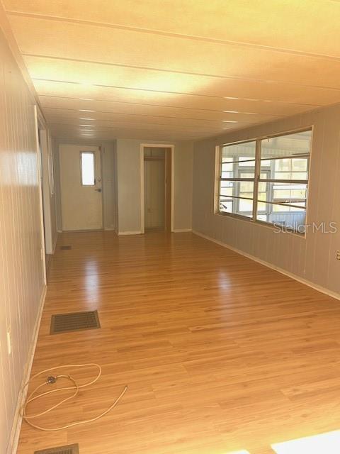 10315 Cortez Road West, Unit 15G Bradenton, FL 34210 - Photo 6 of 77 a view of empty room with wooden floor and fan