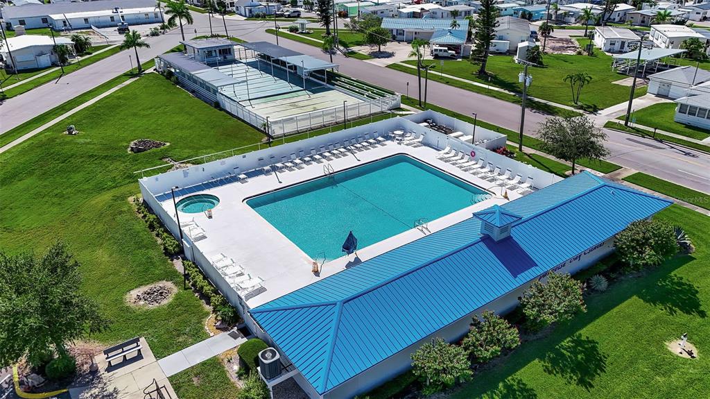 10315 Cortez Road West, Unit 15G Bradenton, FL 34210 - Photo 66 of 77 an aerial view of a tennis ground with a white house