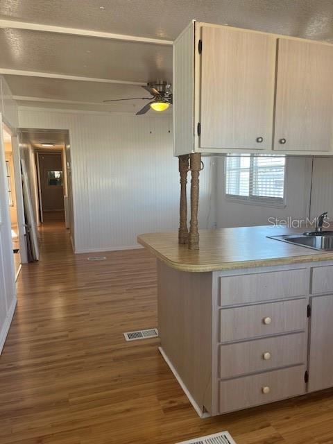 10315 Cortez Road West, Unit 15G Bradenton, FL 34210 - Photo 7 of 77 a kitchen with a sink cabinets and wooden floor
