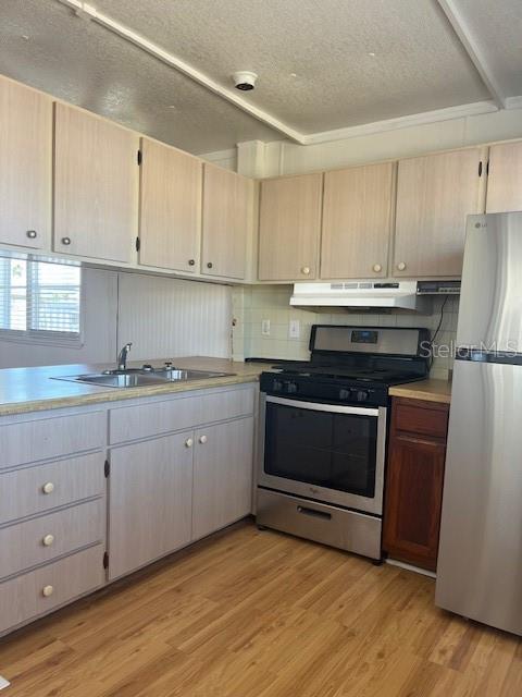 10315 Cortez Road West, Unit 15G Bradenton, FL 34210 - Photo 10 of 77 a kitchen with granite countertop white cabinets and stainless steel appliances