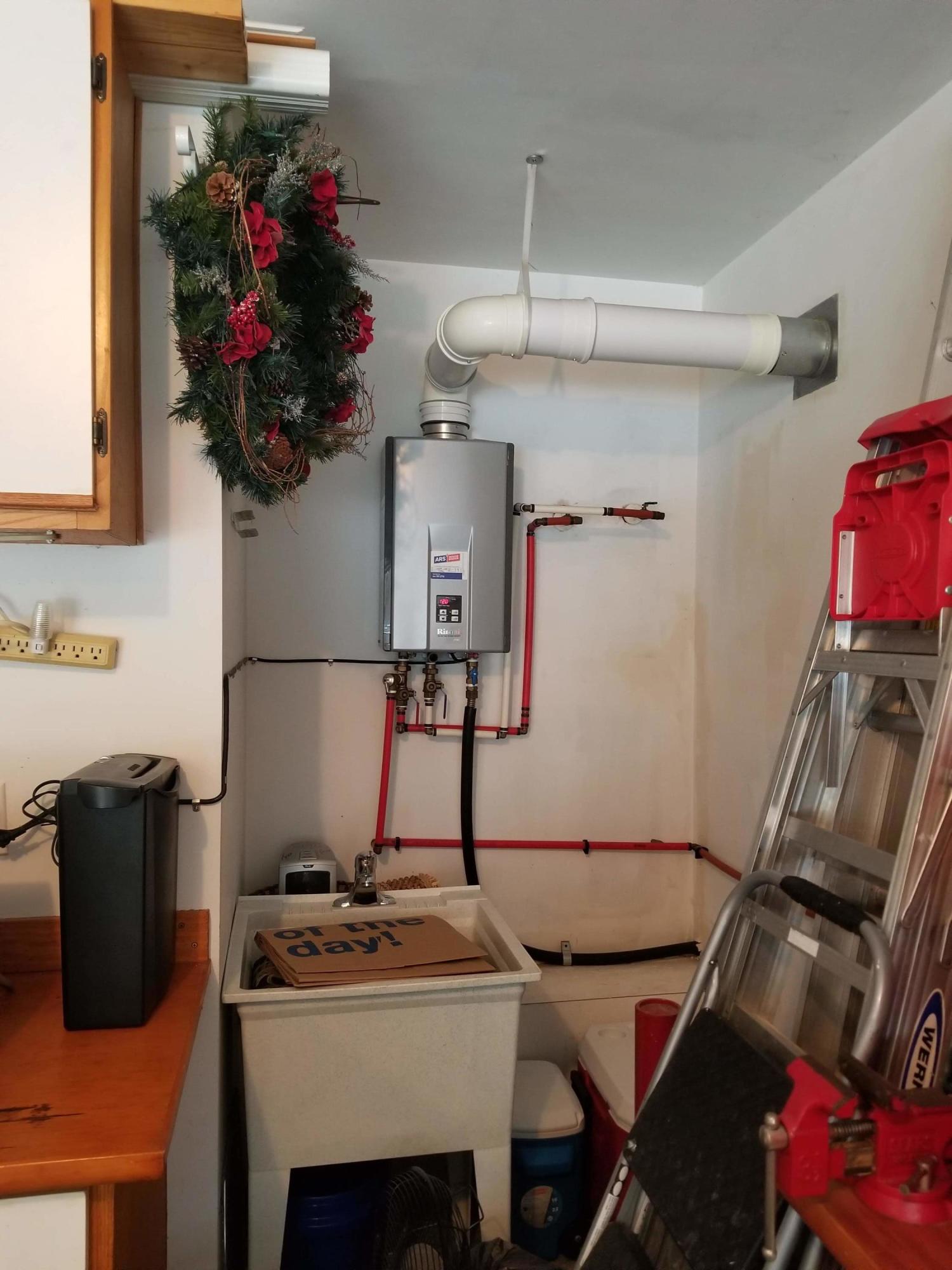 9343 Harroway Road Summerville, SC 29485 - Photo 32 of 41 Tankless water heater and utility sink