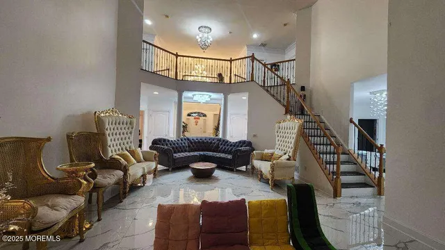 a living room with furniture and stairs