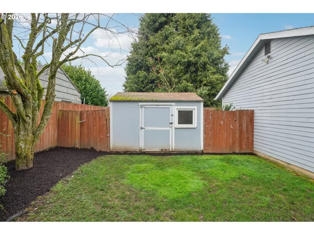 a view of a back yard of the house