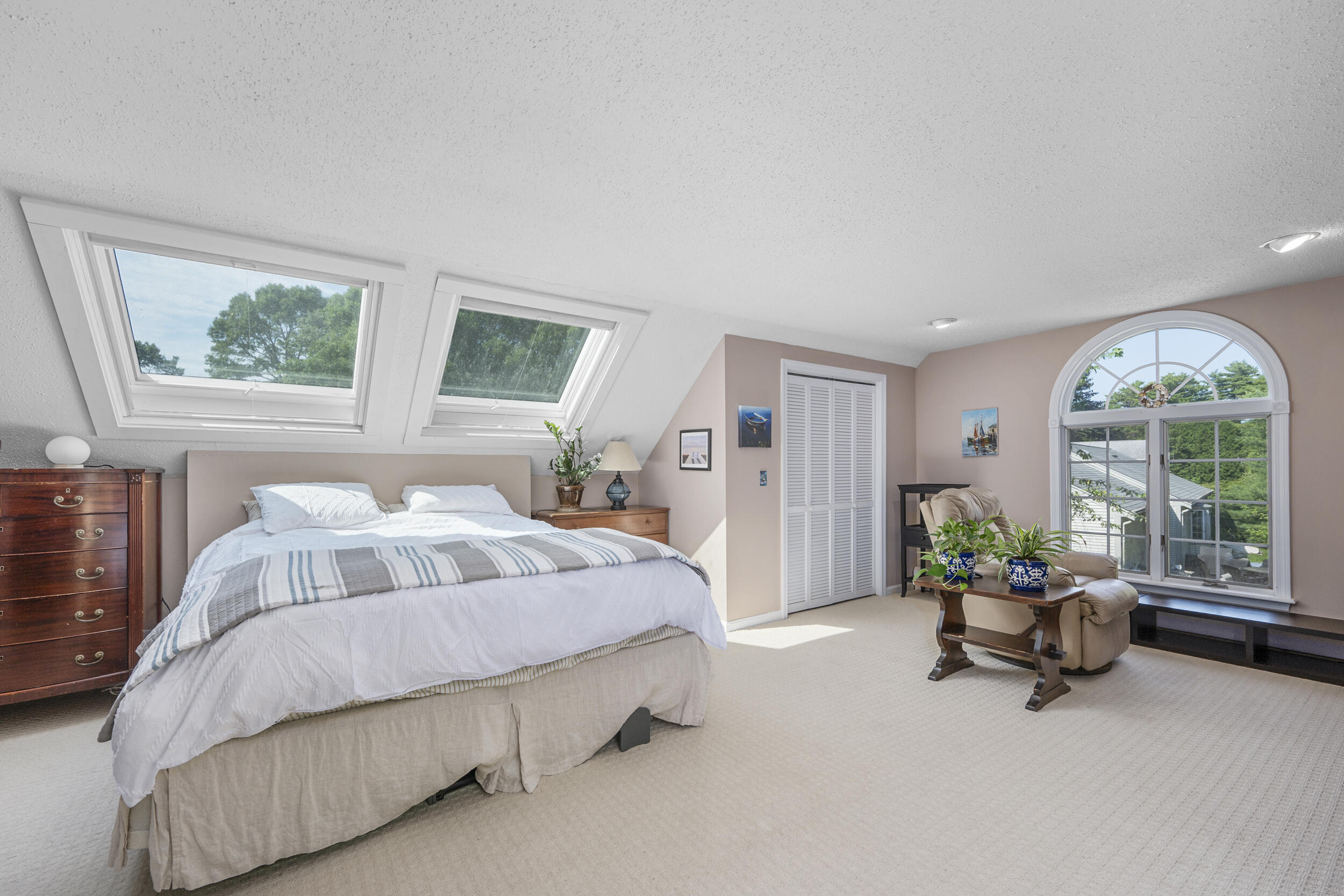 65 Hadrada Lane Centerville, MA 02632 - Photo 18 of 29 a bedroom with a bed and large windows