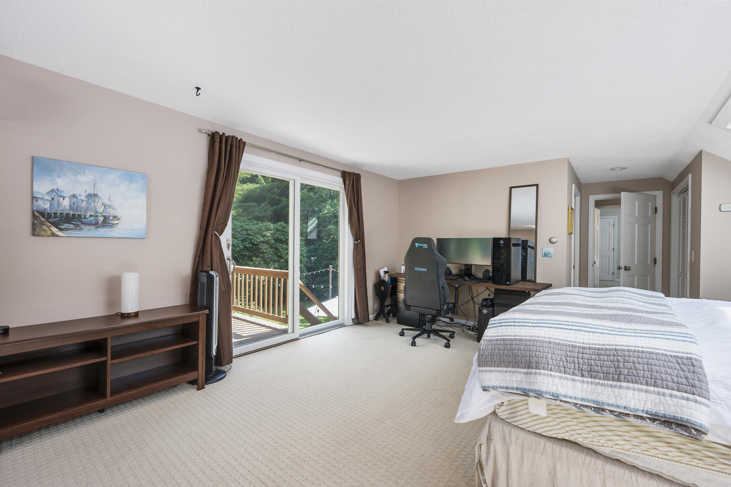 65 Hadrada Lane Centerville, MA 02632 - Photo 19 of 29 a bedroom with bed and glass door