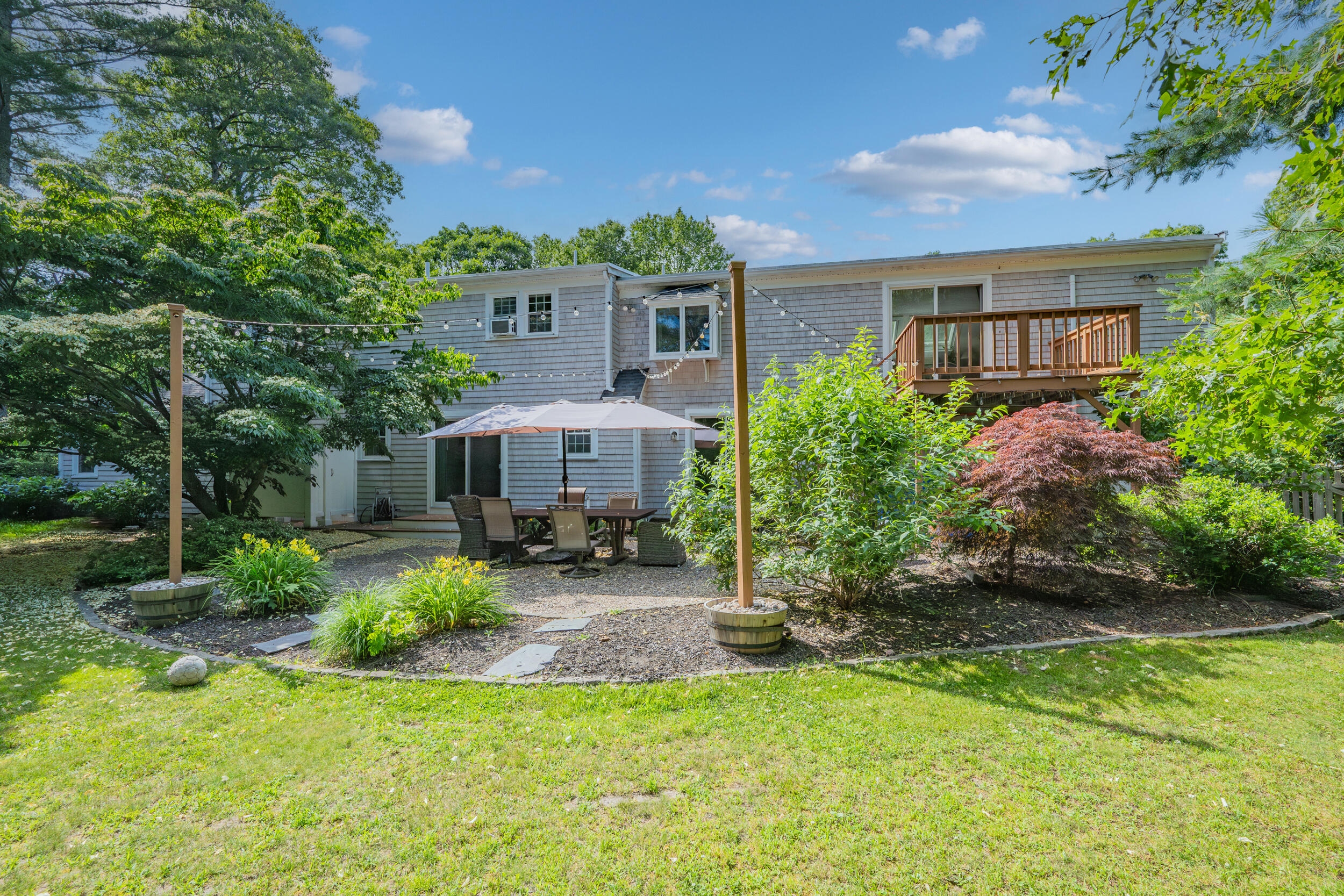 65 Hadrada Lane Centerville, MA 02632 - Photo 22 of 29 a view of a house with backyard garden and swimming pool