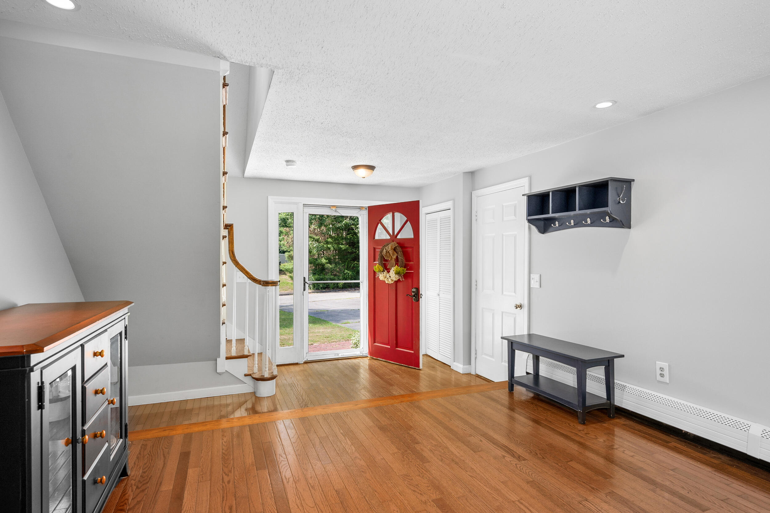 65 Hadrada Lane Centerville, MA 02632 - Photo 3 of 29 a view of an empty room with wooden floor and a window
