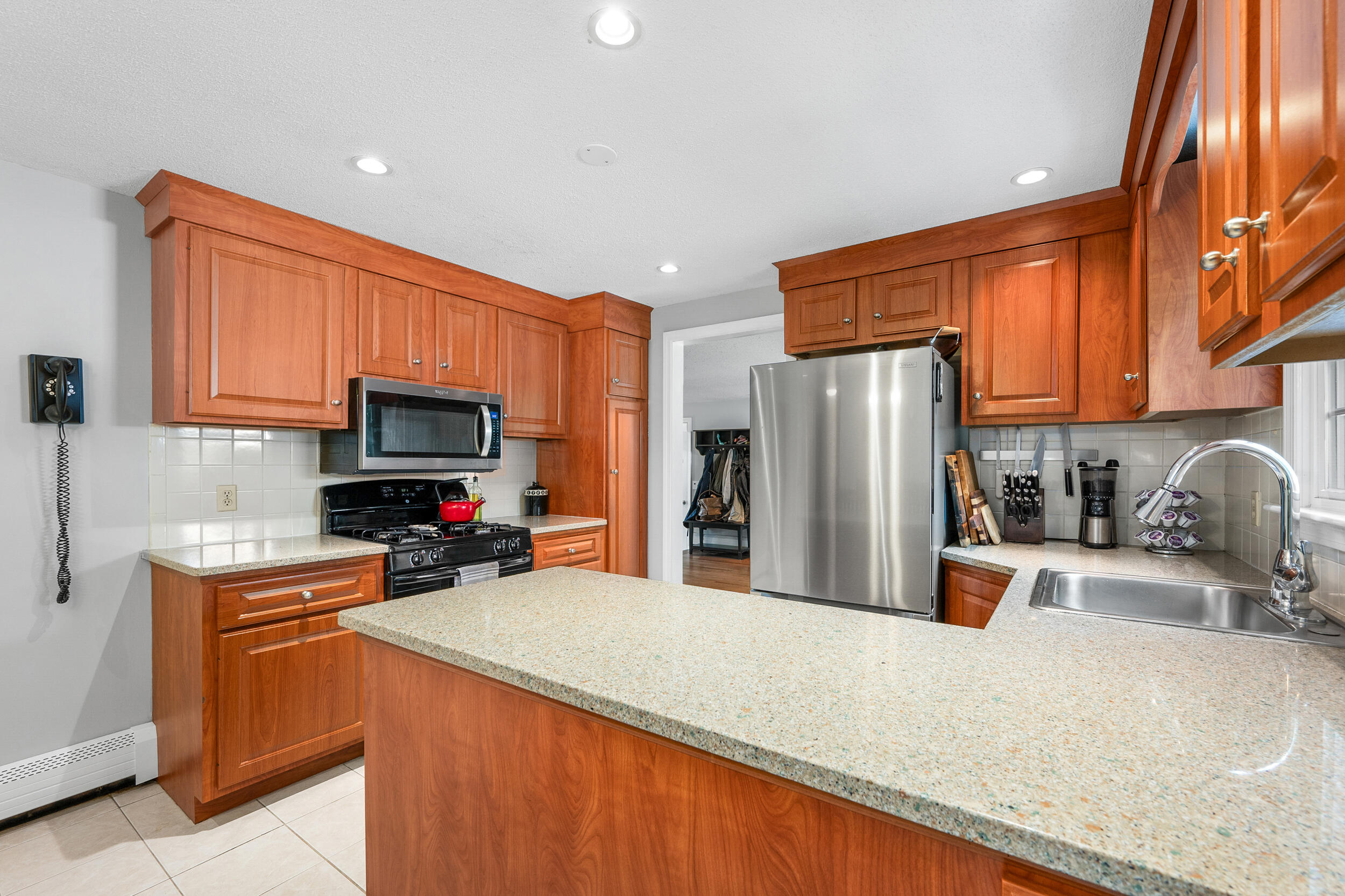65 Hadrada Lane Centerville, MA 02632 - Photo 4 of 29 a kitchen with stainless steel appliances a refrigerator sink and microwave