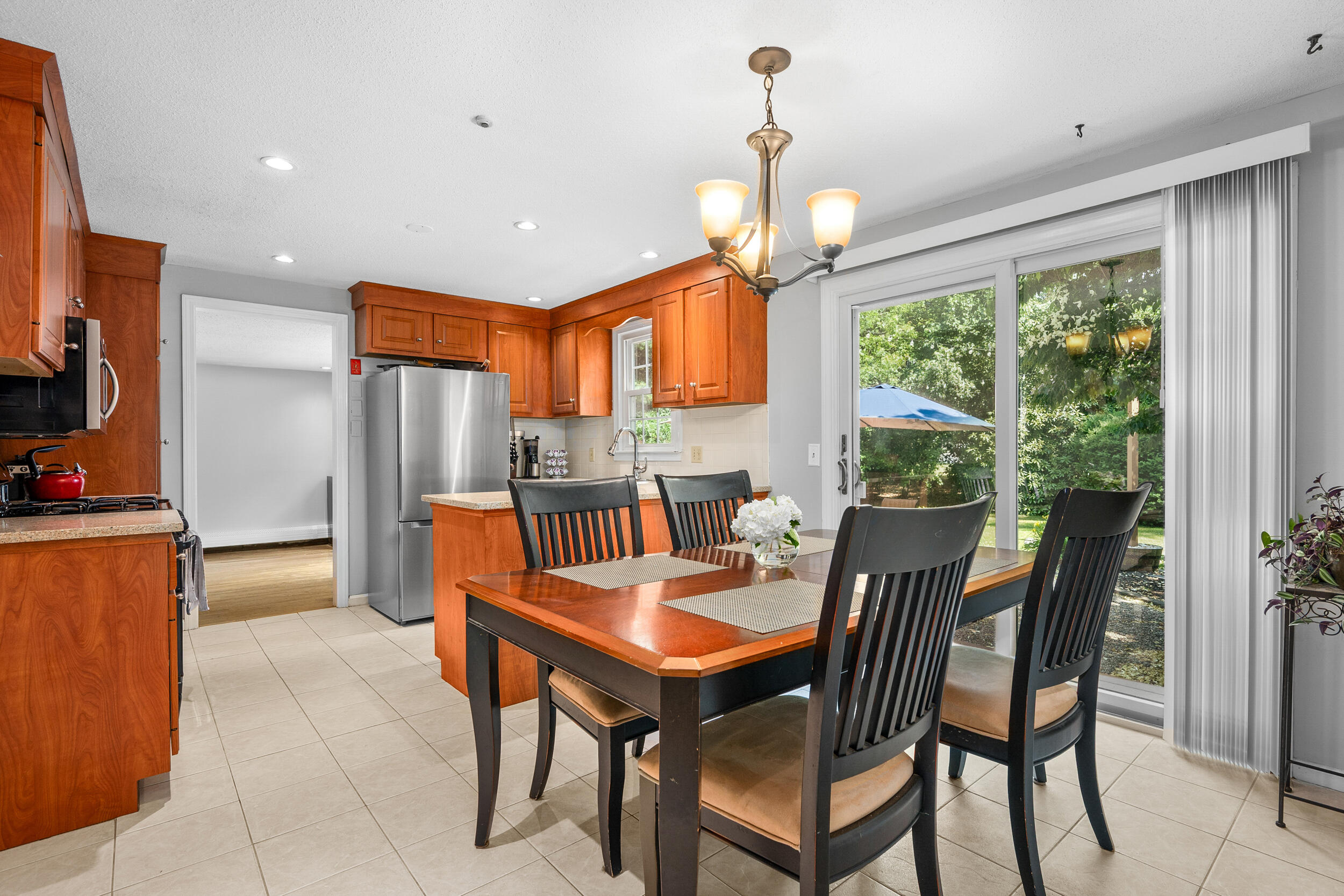 65 Hadrada Lane Centerville, MA 02632 - Photo 5 of 29 a dining room with furniture a chandelier and window