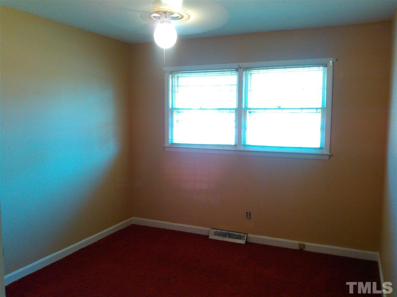 801 Meadowlark Road Dunn, NC 28334 - Photo 14 of 22 an empty room with a window