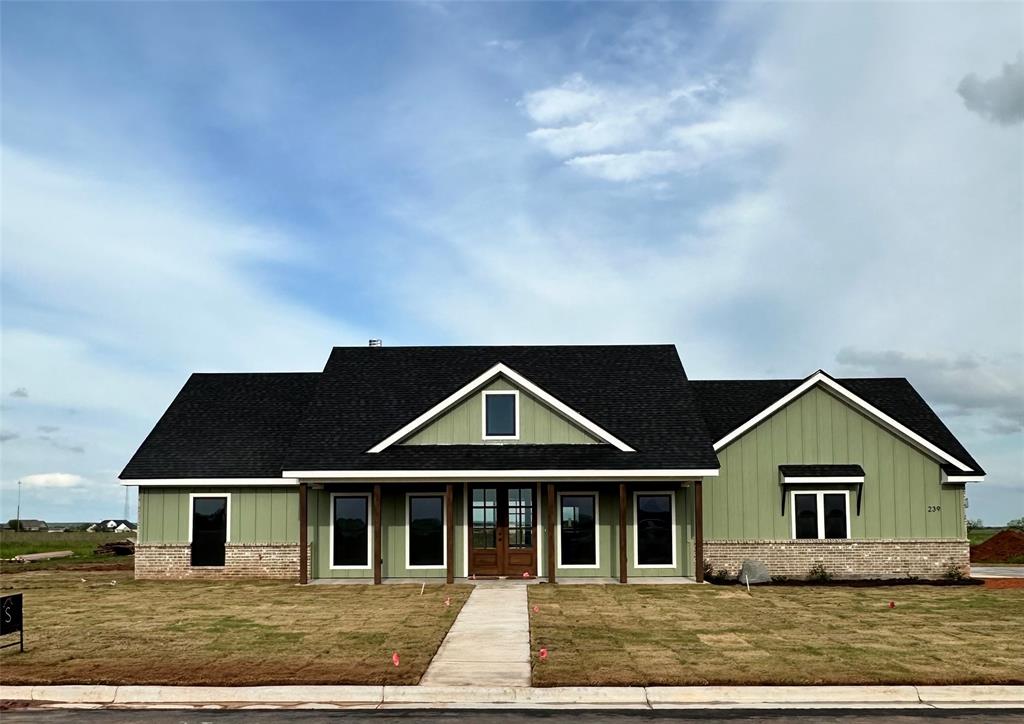 a front view of a house with yard