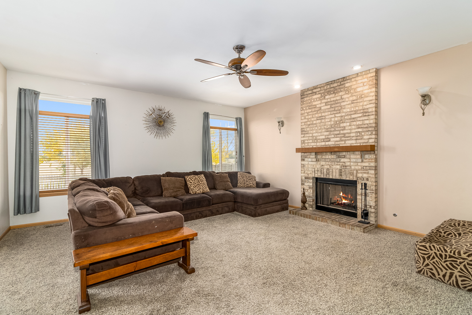 25801 South Red Oak Road Channahon, IL 60410 - Photo 9 of 24 a living room with furniture a fireplace and a flat screen tv