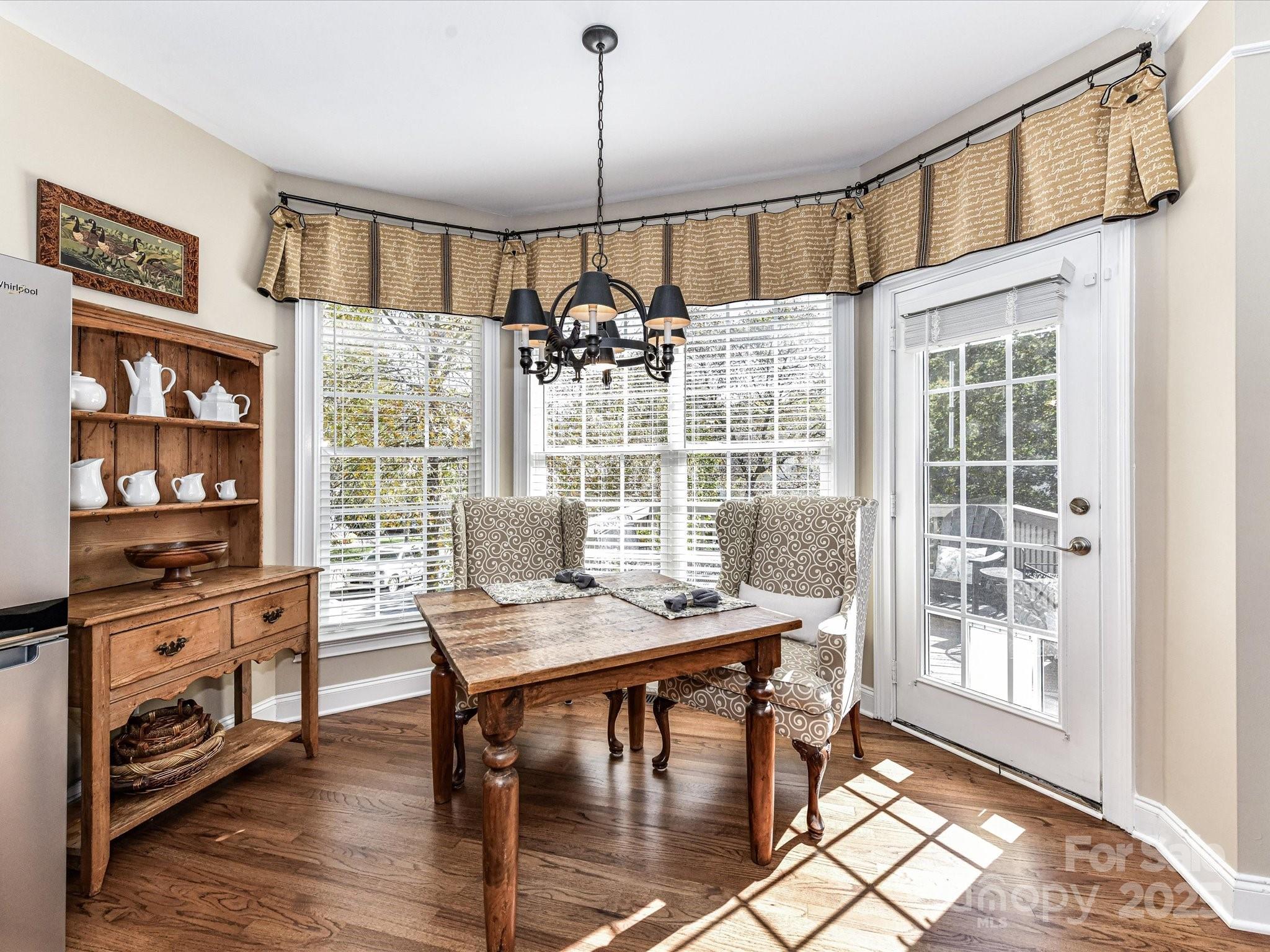 238 Fairview Lane Davidson, NC 28036 - Photo 15 of 40 a view of a dining room with furniture window and wooden floor