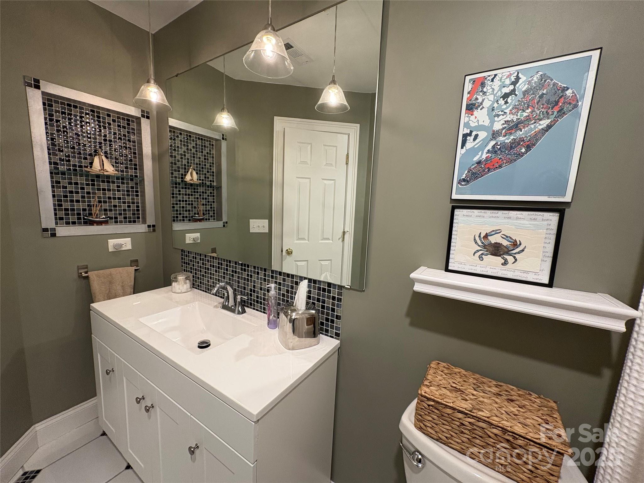 238 Fairview Lane Davidson, NC 28036 - Photo 24 of 40 a bathroom with a sink and a mirror