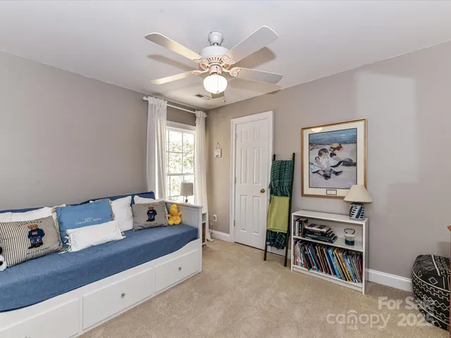 a bedroom with furniture and a window