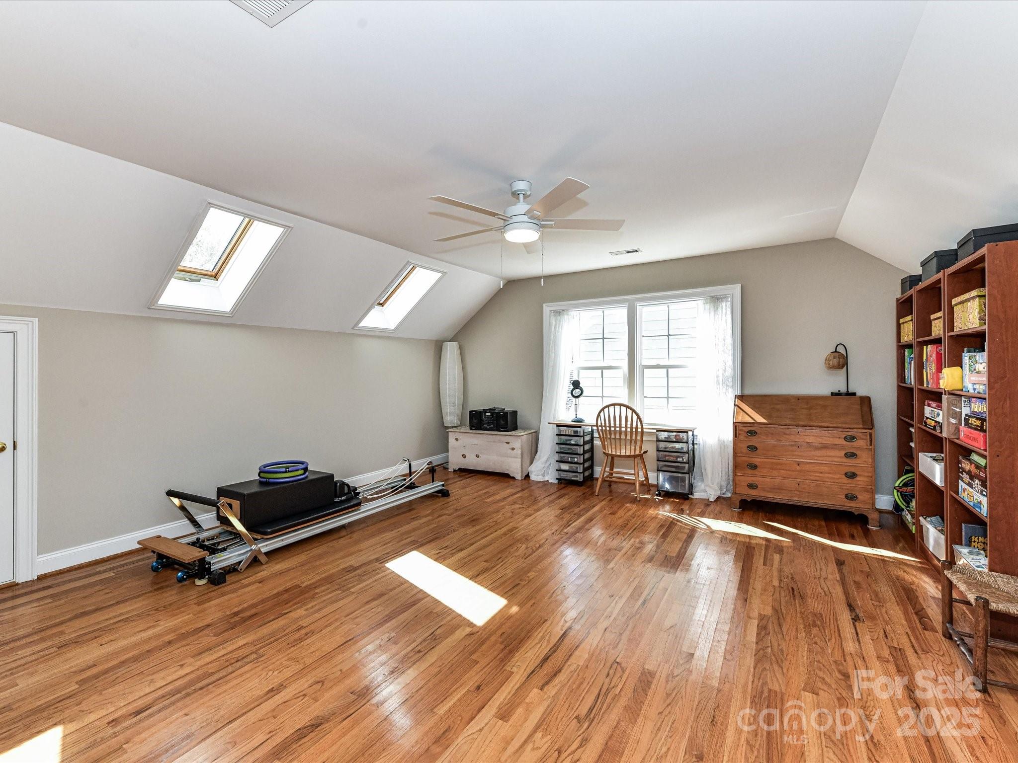 238 Fairview Lane Davidson, NC 28036 - Photo 27 of 40 a living room with furniture gym equipment and a large window