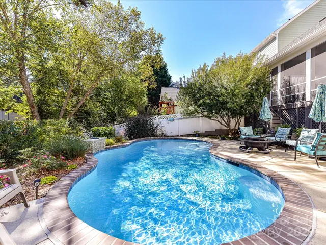 a view of a swimming pool with an outdoor seating