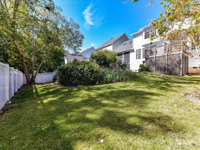 a backyard of a house with lots of green space