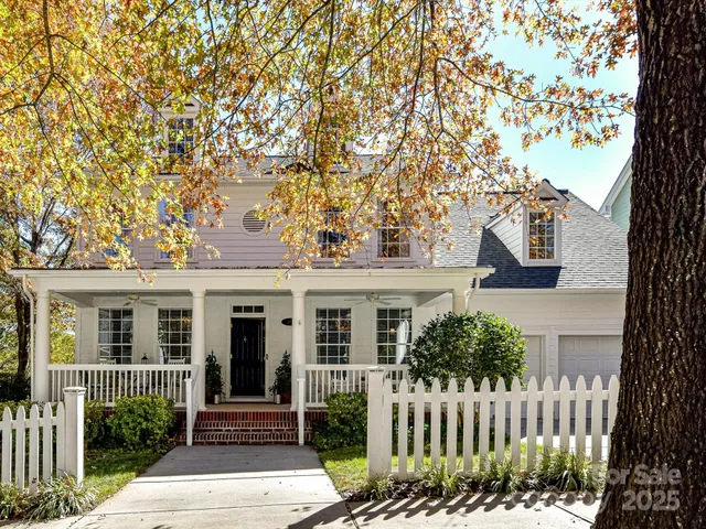 front view of a house with a bench