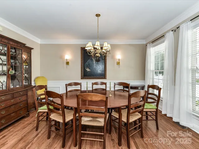 a view of a dining room with furniture and window