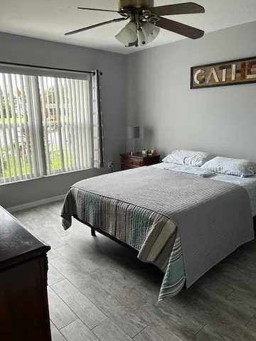 a bedroom with a bed and window