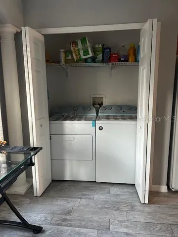 a view of a park with large trees