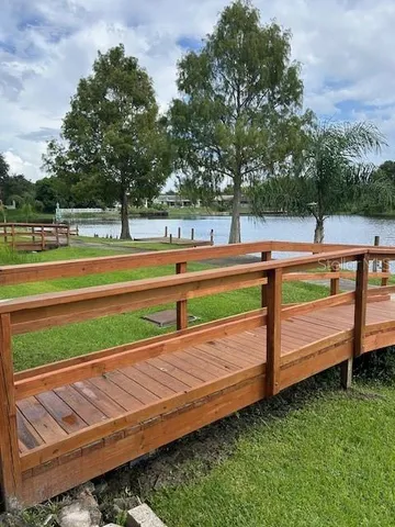 a view of a lake with houses in the back