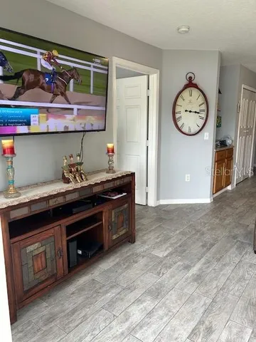 a very nice looking room with lots of frames on the wall