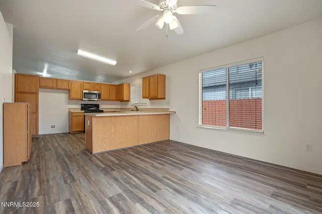 a view of kitchen with wooden floor